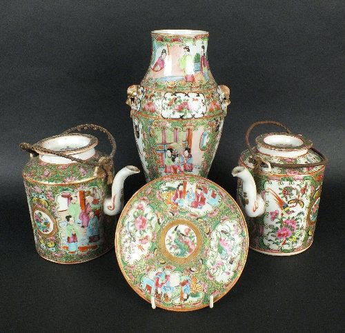 A group of Chinese porcelain Canton enamel famille rose: A group of Chinese porcelain Canton enamel famille rose wares, to include a teapot and cover, 20th century, decorated with panels of figures on terraces and birds amid fruit and flowers, gilt medallio