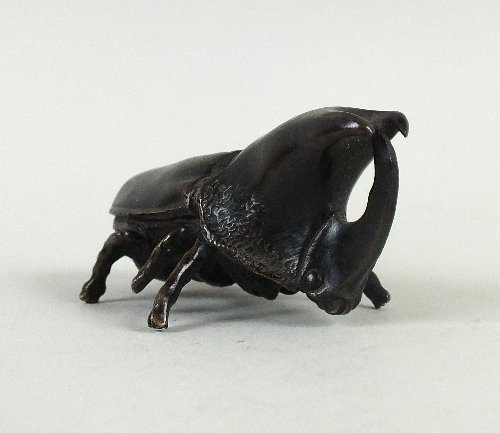A Japanese bronze model of a stag beetle, late Meiji: A Japanese bronze model of a stag beetle, late Meiji period, naturalistically detailed with wings folded, unsigned, 6.5cm in length