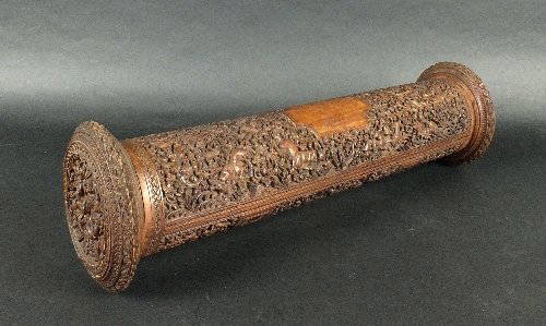 An Anglo-Indian carved sandal wood scroll case, second: An Anglo-Indian carved sandal wood scroll case, second half 19th century, the hinged case of cylindrical form, intricately carved in relief with scenes of tigers hunting deer as other birds and animal