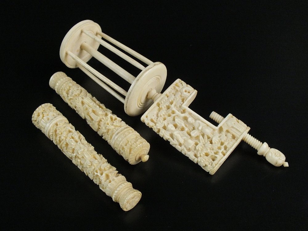 A Chinese Canton export sewing bobbin, mid-19th: A Chinese Canton export sewing bobbin, mid-19th century, modelled with a miniature vice, carved in relief with scenes of figures in a garden setting, 15cm long, together with two needle cases and cove