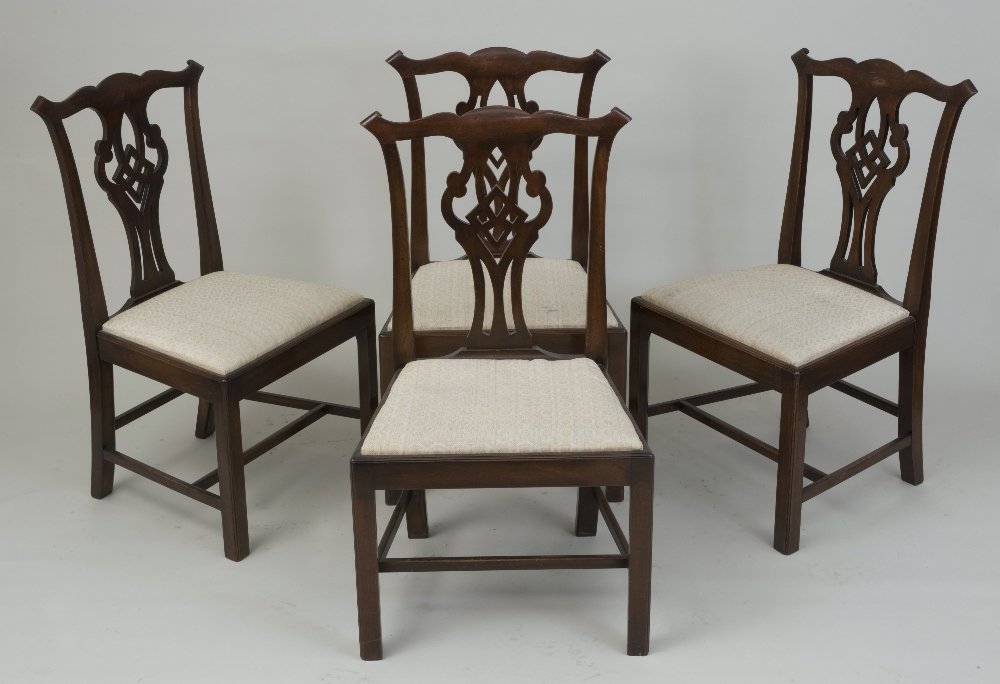 A set of four 19th century mahogany ribbon back dining: A set of four 19th century mahogany ribbon back dining chairs; with cupids bow top rails and with square chamfered legs in the manner of Thomas Chippendale 21 1/2in(54.5cm)W x 37in(94cm)H