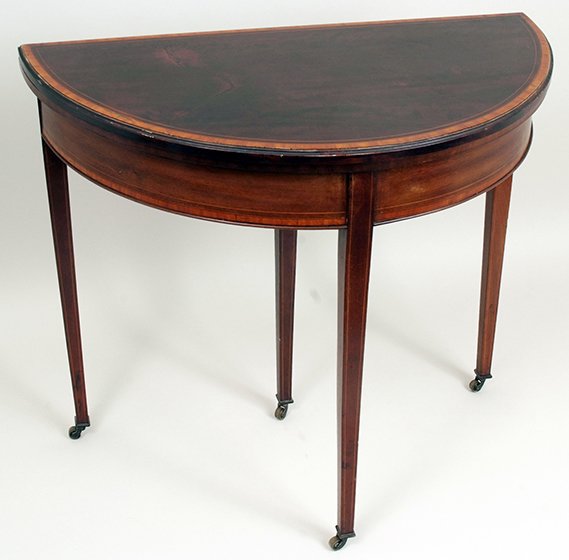 A Victorian half round mahogany card table with: A Victorian half round mahogany card table with satinwood banding and stringing, raised on square tapering legs, the central pull-out back leg numbered, 36436, 33in wide.