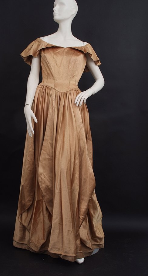 A Collection of 1950's Gold Evening Dresses, including: A Collection of 1950's Gold Evening Dresses, including a circa 1950's Charles Frederick Worth Ballgown. Beautifully tailored from a heavy weight Gold Silk Satin, originating from the famous silk house