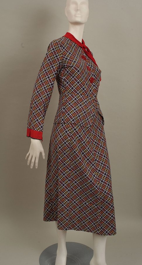 1940's ladies cotton print suit with a peplum nipped in: 1940's ladies cotton print suit with a peplum nipped in the waist jacket, large original buttons, crepe silk tie at neck and below knee, A-line skirt, size small. 1940's brown velvet cape with crepe s
