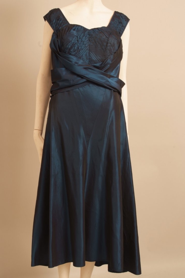 A Quantity of vintage outfits: 1950's Taffeta rayon: A Quantity of vintage outfits: 1950's Taffeta rayon silk evening dress with bolero. A deep wine red colour, dropped waist, ankle length and fully lined in heavy cotton, back metal zip, size 16. A 1950