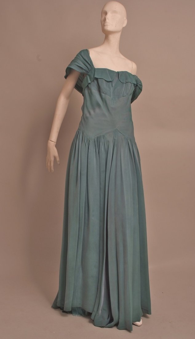 1950's 'Lee Dalman' ball gown. Jade green shimmering: 1950's 'Lee Dalman' ball gown. Jade green shimmering silk organza, figure hugging boned bodice, with gathered silk straps that hang loosely across the shoulders. The skirts fall from a dropped fitted
