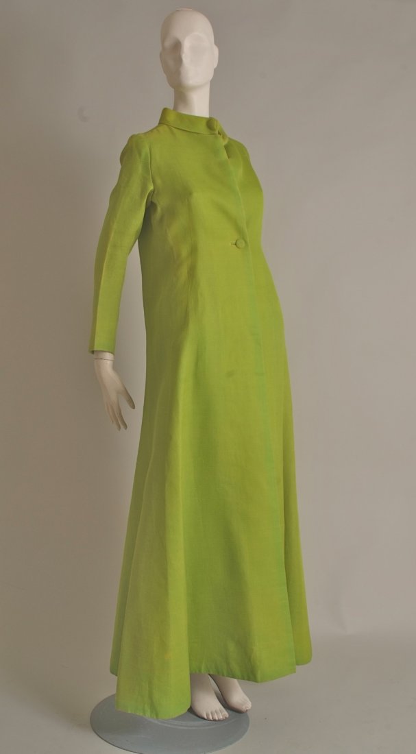 1950's Givenchy Evening Coat. Lime green silk gazarre,: 1950's Givenchy Evening Coat. Lime green silk gazarre, long, elegant, cut to accentuate the feminine curves. Flowing from a Nero collar down to a buttoned waist, nipped and shaped to flow with the bod