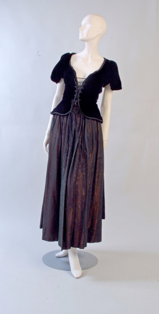1960's 'Yves Saint Laurent' Gypsy Collection Skirt and: 1960's 'Yves Saint Laurent' Gypsy Collection Skirt and Blouse. A soft black silk velvet blouse/jacket with low cut front and lacing. Slightly puffed sleeves. Beautiful nipped waist. Size 40. A burgund