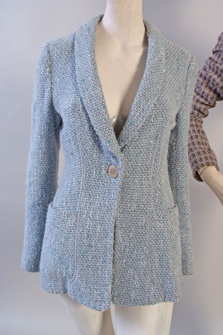 An 'Armani' Tweed Jacket. A light blue wool with: An 'Armani' Tweed Jacket. A light blue wool with metallic blue threads, mixed black and white threads woven with light blue sequins. Fitted waist with rib detail, pockets and front button, labelled 'A