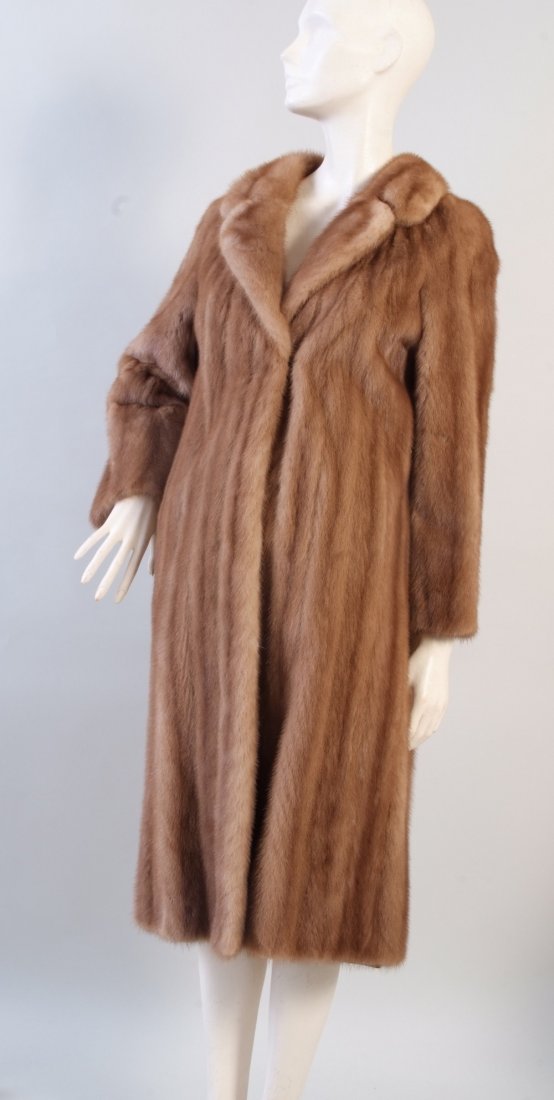 A Vintage Mink Fur Coat. A good condition light brown: A Vintage Mink Fur Coat. A good condition light brown mink coat. Deep side pockets, pretty collar metal fasteners, embroidered silk lining. (1)