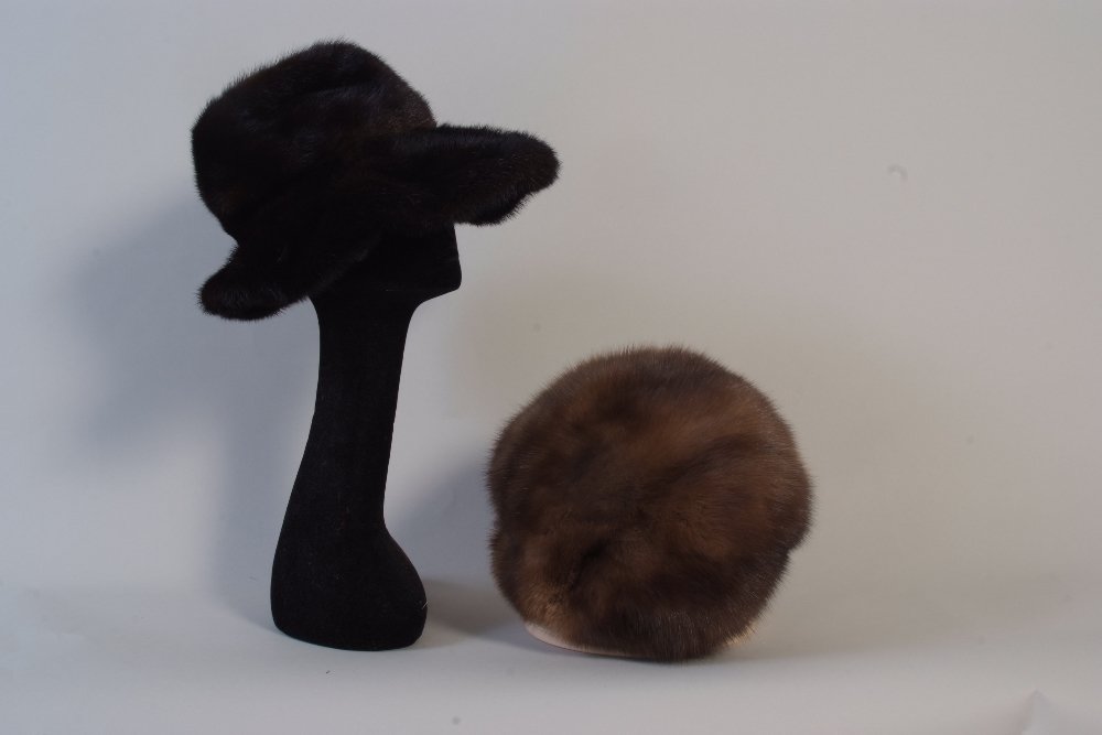 Two 1950's 'Mr John' Fur Hats. To include a dark mink: Two 1950's 'Mr John' Fur Hats. To include a dark mink fur hat and a further light soft fur hat, both labelled 'Mr John', with Mr.John lining. (2)