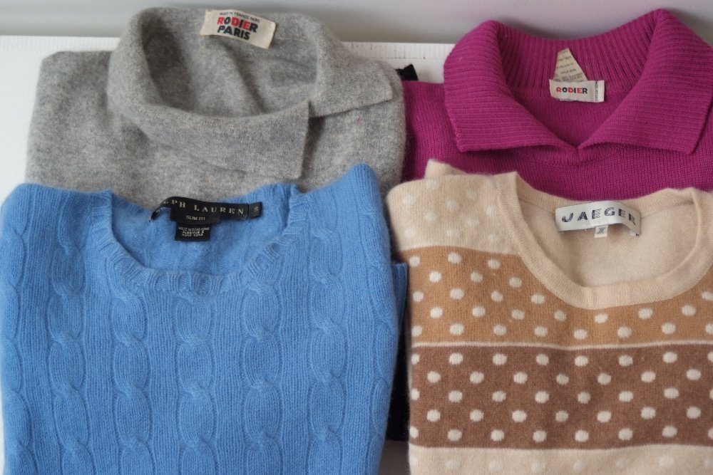 4 x Designer Jumpers. A 'Rodier' fuschia and black: 4 x Designer Jumpers. A 'Rodier' fuschia and black jumper with collar. A 'Rodier' Paris grey cashmere jumper with pretty collar. A blue 'Ralp Lauren' Cashmere jumper and a 'Jaeger' Cashmere polka dot