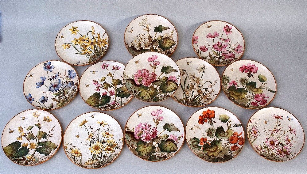 A George Jones part dessert service, 'Familiar: A George Jones part dessert service, 'Familiar Flowers', comprising twelve side plates and a tazza, decorated with garden flowers and bumble bees in the Aesthetic style