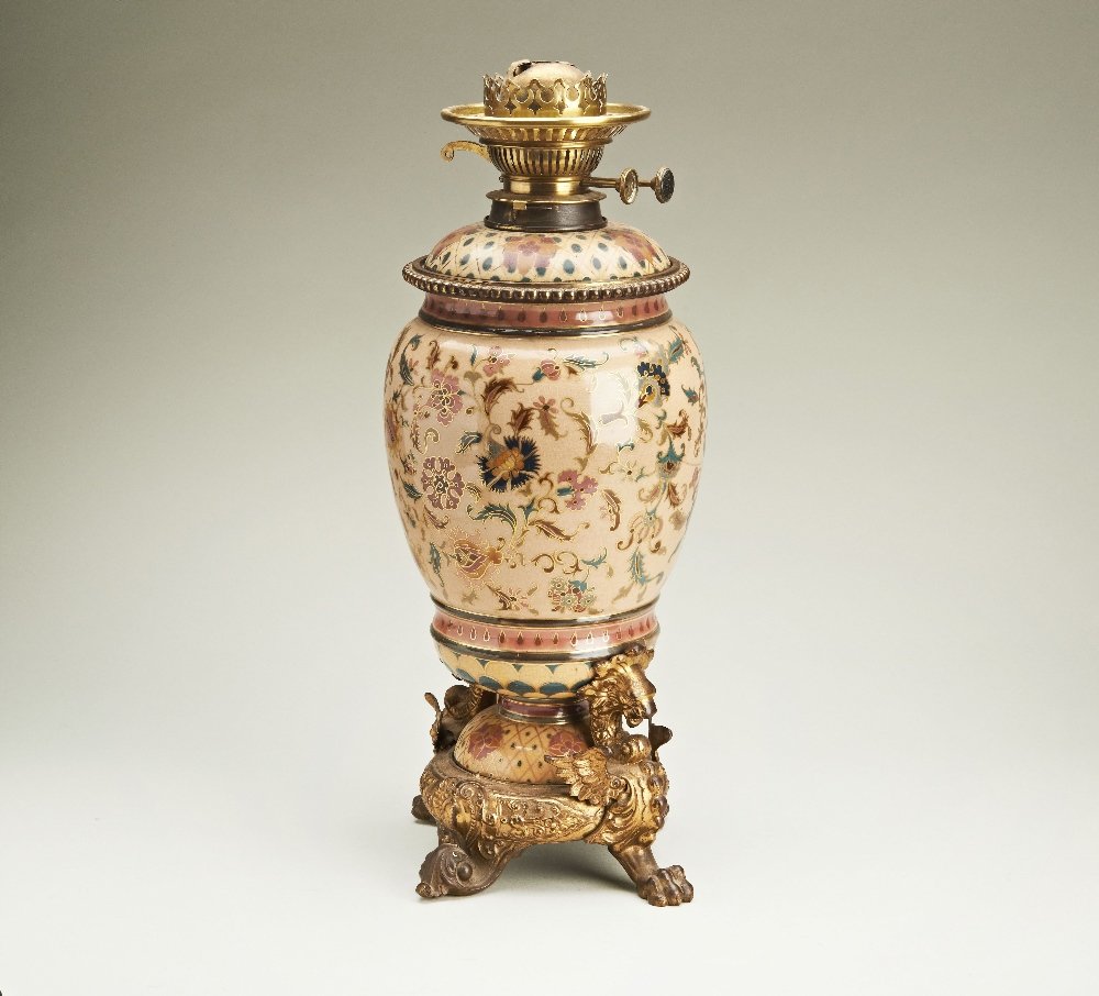 A late Victorian Messenger and Sons of Birmingham Oil: A late Victorian Messenger and Sons of Birmingham Oil Lamp with a Zsolnay Pecs body. Persian pattern. With ovoid griffin cast metal mounts. 46cm (18 7/64in) x 18cm (7 3/32in).