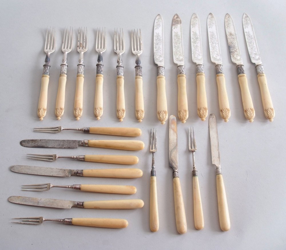 A set of six Victorian silver and ivory handled knives: A set of six Victorian silver and ivory handled knives and forks, by William Hutton & Sons, London 1892, the foliate engraved blades and collars, with leaf engraved handles, with diamond finials, toge