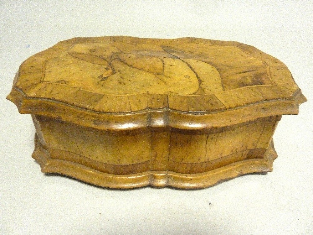 A Maltese casket of serpentine form, the domed cross: A Maltese casket of serpentine form, the domed cross banded top enclosing a velvet lined interior on bun feet, late 18th century, 30cm (11 13/16in).