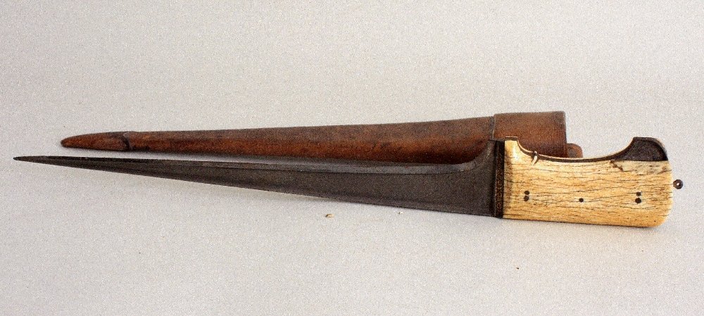 A large late 18th / early 19th century Indo-Persian: A large late 18th / early 19th century Indo-Persian Pesh Kabz dagger, tapering blade formed with reinforced back-edge, the gilt iron hilt decorated with foliage and flying beetle, (some minor loss to 
