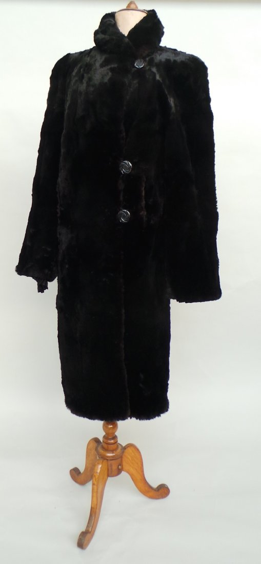 A very unusual early 1900's soft black moleskin coat.: A very unusual early 1900's soft black moleskin coat. The coat is labelled 'Yaeger' furs Ltd. and was made in Canada. The garment is satin lined and in fair condition for its age. Approx size 12/14.