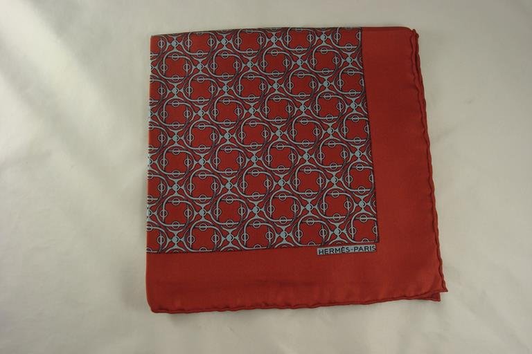 HERMES 100% SILK SCARF: HERMES, PURCHASED IN FRANCE. HAND ROLLED HEMS AND PURE SILK. MEASURES ABOUT 16 1/2 INCHES SQUARE. THESE SCARVES ARE CALLED POCHETTE OR \'POCKET SCARVES\'. HERMES IS SHOWING THESE SCARVES TIED TO THEIR