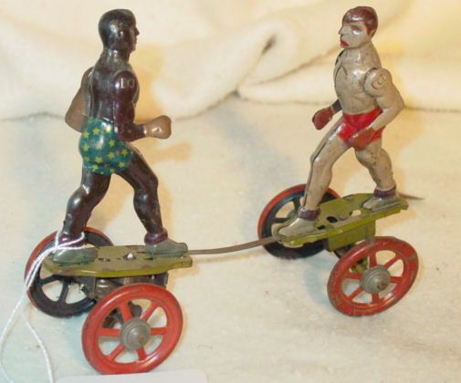 Jack Johnson Gene Tunney boxing wind up toy: tin litho windup toy of Jack Johnson and Gene Tunney boxing, original paint, marked Germany, DRR impressed, 5 1/2" tall, good condition