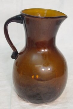Clevenger hand blown pitcher: hand blown brown glass pitcher with applied handle made by the Clevenger company, 8" tall, excellent condition