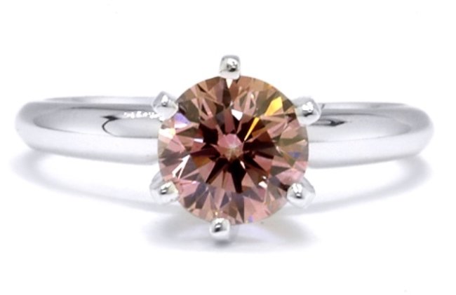.55 CT VS Round Cert. 14K Gold Pink Diamond Ring: 14K White Gold Pink Diamond Ring. Pink Diamonds are probably one of the most popular Diamonds in the world. A pink diamond is the ultimate symbol of love, grace and femininity. 100 percent Natural Dia