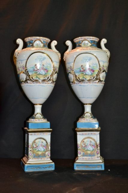 Contemporary Limoges Vases Romantic Scene 23": This is a pair of contemporary Limoges vases, each has a romantic scene on the front of the vase and base, also gilt. 23 1/2" Tall on the base.