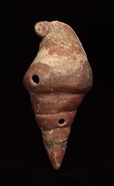 NARINO OCARINA WITH CHARMING MONKEY ON TOP: NARINO OCARINA WITH CHARMING MONKEY ON TOP, Capuli Complex, 850-1500 AD. In the form of a red glazed sea shell with incised designs and a molded monkey on the top. 4.6". The monkey is much clearer tha