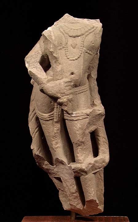 SIZABLE EARLY INDIAN VISHNU: EARLY INDIAN STONE FIGURE, ca. 10th century AD. The body of a male god likely Vishnu. 10.6 inches. On custom stand. Provenance: An extensive 20th century New Jersey collection. Assembled over the past