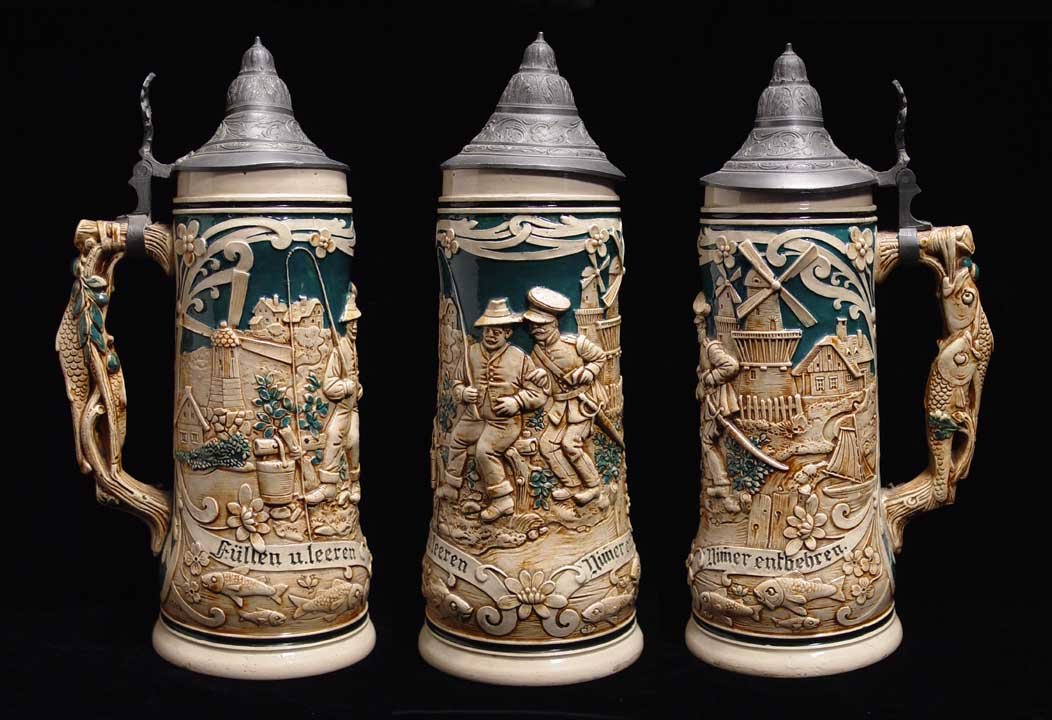 BETTER GERMAN BEER STEIN: BETTER GERMAN BEER STEIN, c. 19th century. Stein with pewter top, fish handle and scene of windmills & fishermen. 11.25 inches. Provenance: An extensive 20th century New Jersey collection. Assembled o