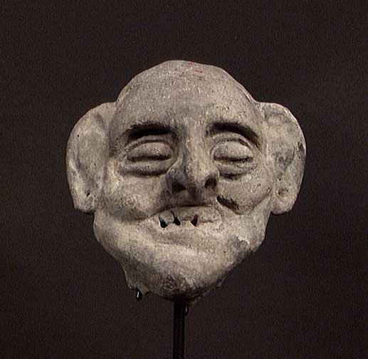 EXCEPTIONAL TUMACO-LA TOLITA GROTESQUE: PRE-COLUMBIAN ART. EXCEPTIONAL TUMACO-LA TOLITA GROTESQUE, ca. 300 BC - 200 AD. The grimacing head of an old man, blind or perhaps deceased. 4". A fine and rare larger example showing the Tumaco conce