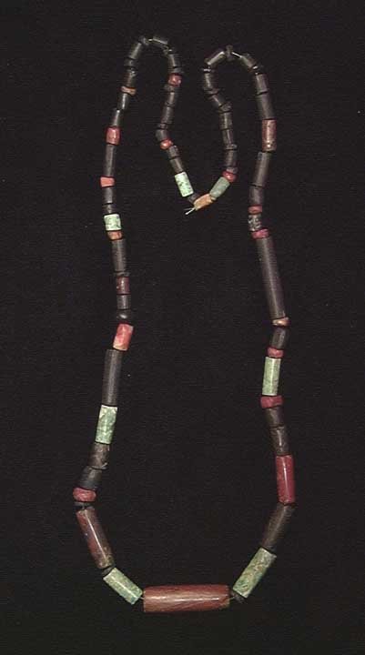 TAIRONA GREEN JADE NECKLACE: PRE-COLUMBIAN. TAIRONA GREEN JADE NECKLACE, c. 1000-1550 AD. With green jade cylindrical beads interspersed with red jasper and black stone cylindrical beads. 24". Provenance: An extensive East Coast 