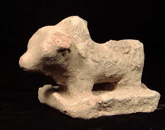 INDUS VALLEY TERRACOTTA BULL: AN INDUS VALLEY TERRACOTTA BULL, c. 2500-1500 BC. Humped bull on base. 4 inches. Provenance: An extensive 20th century New Jersey collection. Assembled over the past 35 years. All pieces have been car