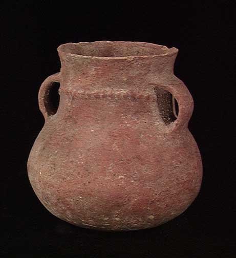 EARLY BRONZE AGE HOLY LAND JUG: EARLY BRONZE AGE HOLY LAND JUG, 3150-2200 BC. The two handled redware vessel with a row of raised dots around the neck. 3.75 x 3.75 inches. Regular lines of red glaze continued on interior of neck.Pro