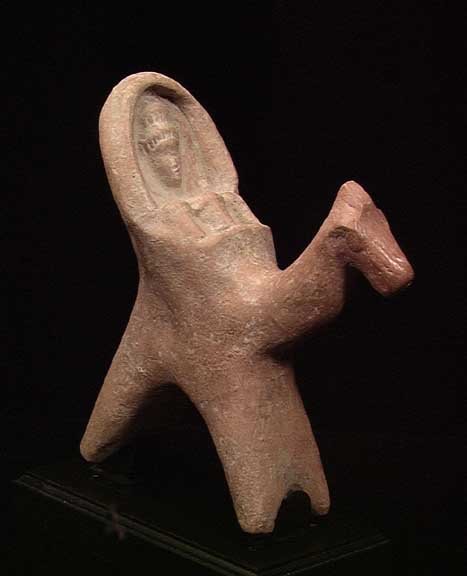SYRO-HITTITE HORSE WITH MULTIPLE RIDERS: AN EXCEPTIONAL SYRO-HITTITE HORSE WITH MULTIPLE RIDERS, ca. 1000 BC. The piece with alcove with the head of Astarte above three smaller male faces. 5 x 5.5 inches. Very rare and desirable type. On cus
