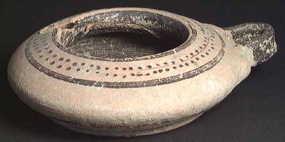 LATE CORINTHIAN EXALEIPTRON: LATE CORINTHIAN EXALEIPTRON, 525-500 BC. The distinctively shaped vessel with dot and line pattern. 2 x 7.4 inches across handle. Nice large example. Rare. Provenance: An extensive 20th century New