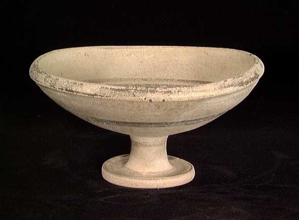 DAUNIAN GREEK PEDESTAL PLATE: A DAUNIAN GREEK PEDESTAL PLATE, ca. 3rd century BC. The buff-ware plate on pedestal base with concentric rings of brown glaze. 3.3 x 6.5 inches. Provenance: An extensive 20th century New Jersey collec
