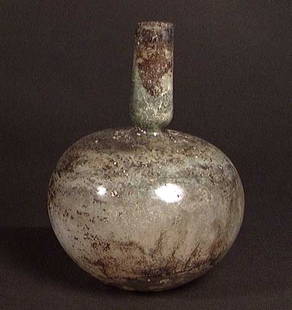 LARGER ROMAN GLASS BOTTLE,: LARGER ROMAN GLASS BOTTLE, ca. 1st-3rd century. With globular body original trimmed rim. Three faint wheel cut bands on the pinched neck. 4.4 x 5.75".Provenance: An extensive 20th century New Jersey