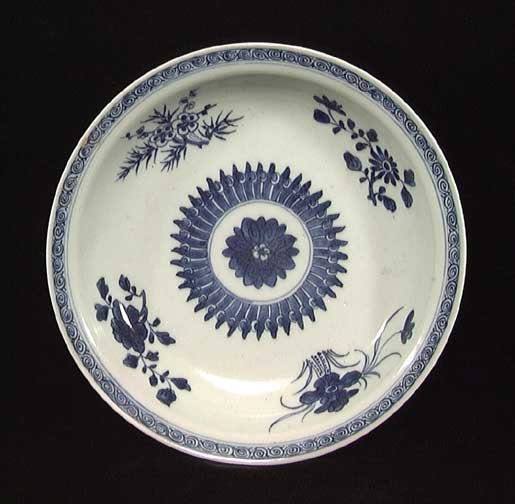 FINE CHIEN LUNG BLUE AND WHITE BOWL: FINE CHIEN LUNG BLUE AND WHITE BOWL, 1736-1795. The finely fired porcelain bowl with floral pattern and seal on bottom. 7.8 inches. Provenance: The collection of a Midwestern business executive. Acqui