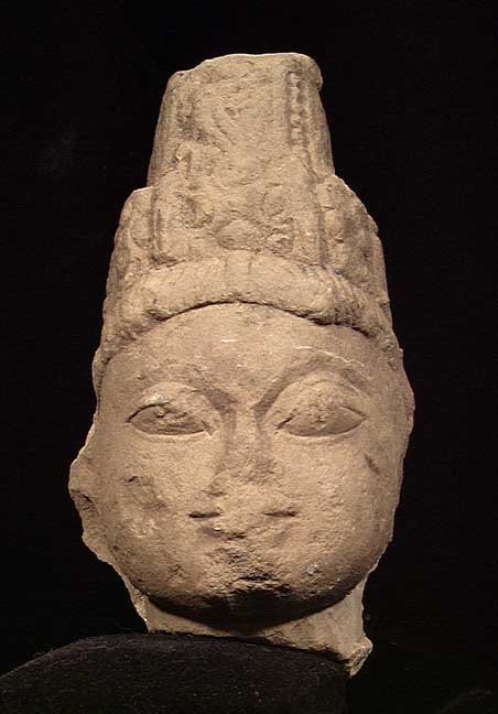 EARLY INDIAN STONE HEAD OF A PRINCE: EARLY INDIAN STONE HEAD OF A PRINCE, ca. 10th century AD. Wearing a tall royal headdress. 7.5 inches. Provenance: An extensive 20th century New Jersey collection. Assembled over the past 35 years. All