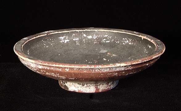 GREEK BLACK-GLAZED PEDESTAL DISH: A GREEK BLACK-GLAZED PEDESTAL DISH, c. 4th century BC. On ring pedestal base with shallow bowl. 5.1". Intact.Provenance: An extensive 20th century New Jersey collection assembled over the past 35 year