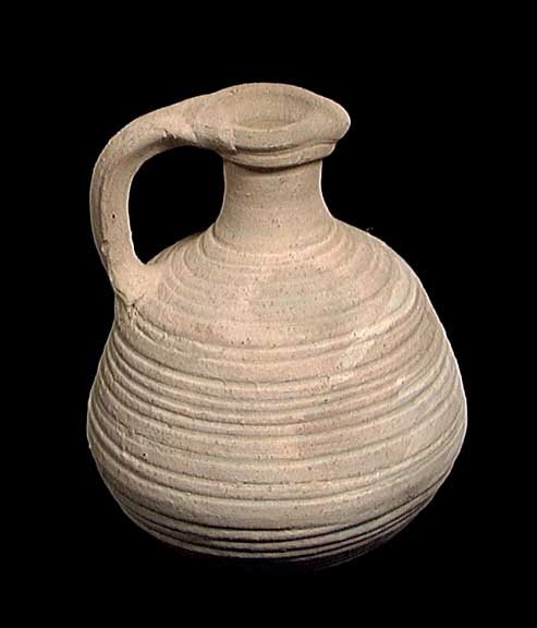 CHOICE BYZANTINE JUG: CHOICE BYZANTINE JUG, ca. 5th-10th century AD. The piriform jug with small pouring spout and ridged sides and base. 5.4 inches. Provenance: The collection of a New York City artist and entertainer. As