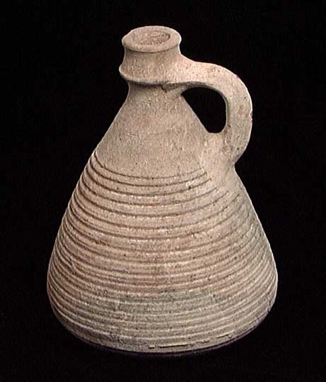 CHOICE BYZANTINE JUG: CHOICE BYZANTINE JUG, ca. 5th-10th century AD. The conical jug with small neck and ridged sides and base. 5.3 inches. Provenance: The collection of a New York City artist and entertainer. Assembled ov