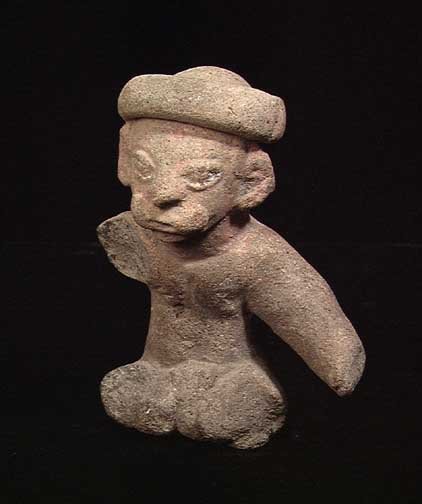 JAMACOQUE COQUERO: A JAMACOQUE COQUERO, ca. 500 AD. The high status male figure wearing a looped headdress which trails down the center of his back, both cheeks stuffed with wads of coca leaves. 3.1". Rare. Provenance: 