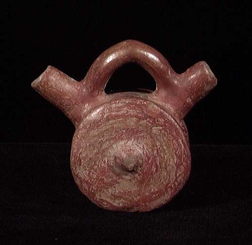 RARE EROTIC CALIMA ALCARRAZA: FEMALE BREASTS FORM CALIMA ALCARRAZA, ca. 300 - 1300 AD. Burnished red glazed double-spouted vessel with central 'nipples' representing female breasts each side, perhaps used as a baby feeder. 3.5". I