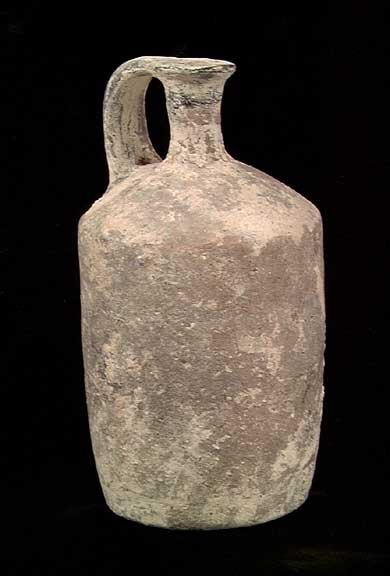 ELEGANT HOLY LAND BRONZE AGE JUG: ELEGANT HOLY LAND BRONZE AGE JUG. Middle Bronze, 2200-1550 BC. The vessel with cylindrical body and thin neck with double strap handle. 3.5 x 6.5 inches. Excellent example. Provenance: An extensive 20