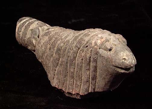 HEAVY WOOLED INDUS VALLEY SHEEP: AN INDUS VALLEY SHEEP, ca. 1st millennium BC. Terra cotta figure depicting a sheep with very heavy wool entirely covering its body. 3.5 inches. Provenance: Purchased by the present owner at a benefit 