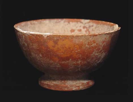 ROMAN FINE WARE BOWL: ROMAN FINE WARE BOWL. c. 1st-3rd century AD. Thin walled red glazed Roman fine ware bowl With two incised marks on the base rim, probably an owner's mark. 2.25 x 4 inches. Provenance: An extensive 20t