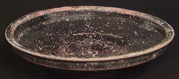 CAMPANIAN BLACK-GLAZED PLATE: CAMPANIAN BLACK GLAZED PLATTER, c. 4th c. BC. With short pedestal base and black glaze. 5.7". Provenance: An extensive 20th century New Jersey collection assembled over the past 35 years. All pieces h