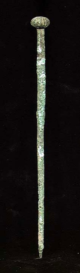 ANCIENT NEAR EASTERN MELON HEAD CLOAK PIN: MELON HEAD ANCIENT HOLY LAND CLOAK PIN, c. 2000 BC. The head in melon form. 7 inches. Provenance: The collection of a prominent Egyptologist by descent assembled in the early part of the 20th century 